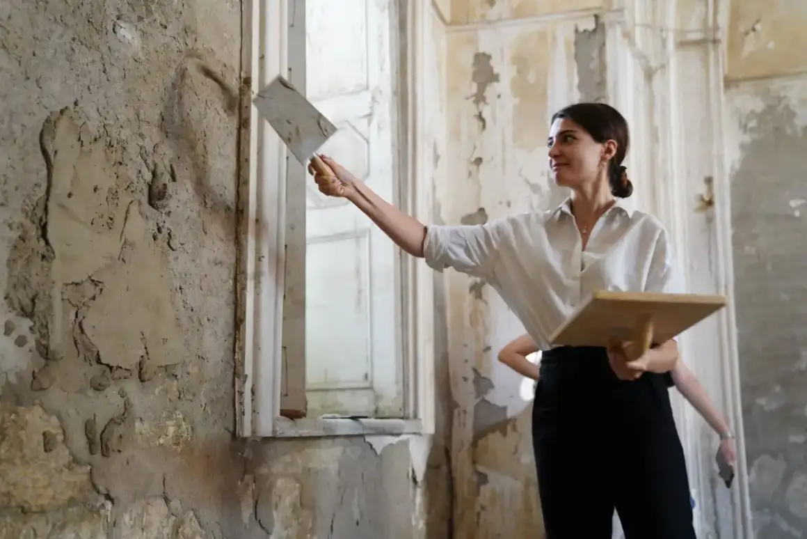 Plaster worked into a damaged wall section during a repair in an older Madison home