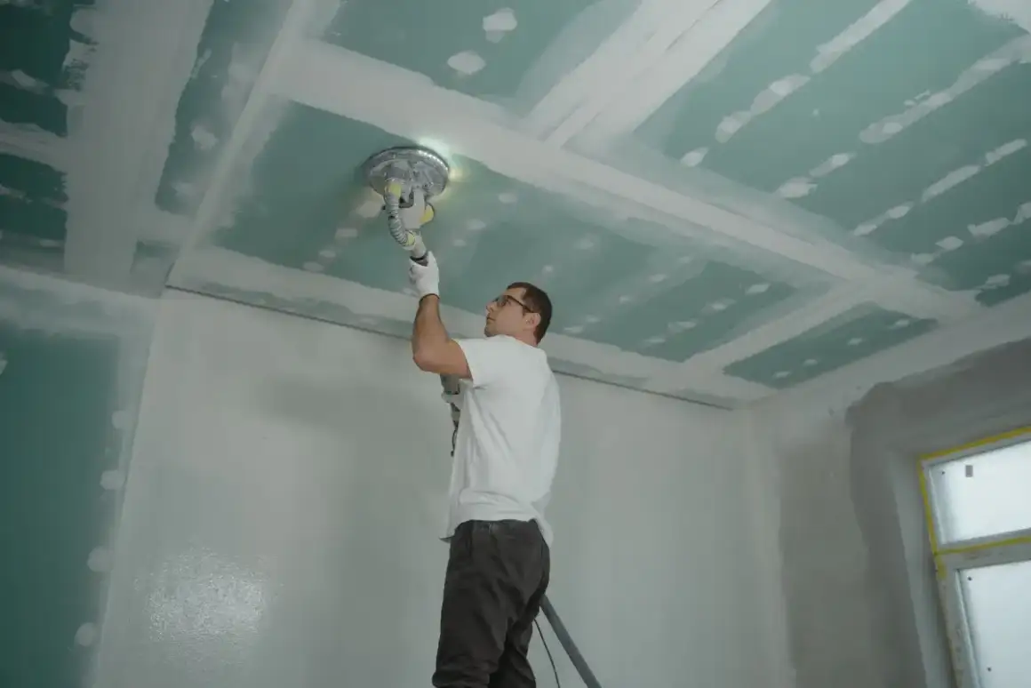 Repaired plaster surface sanded and checked flat before priming