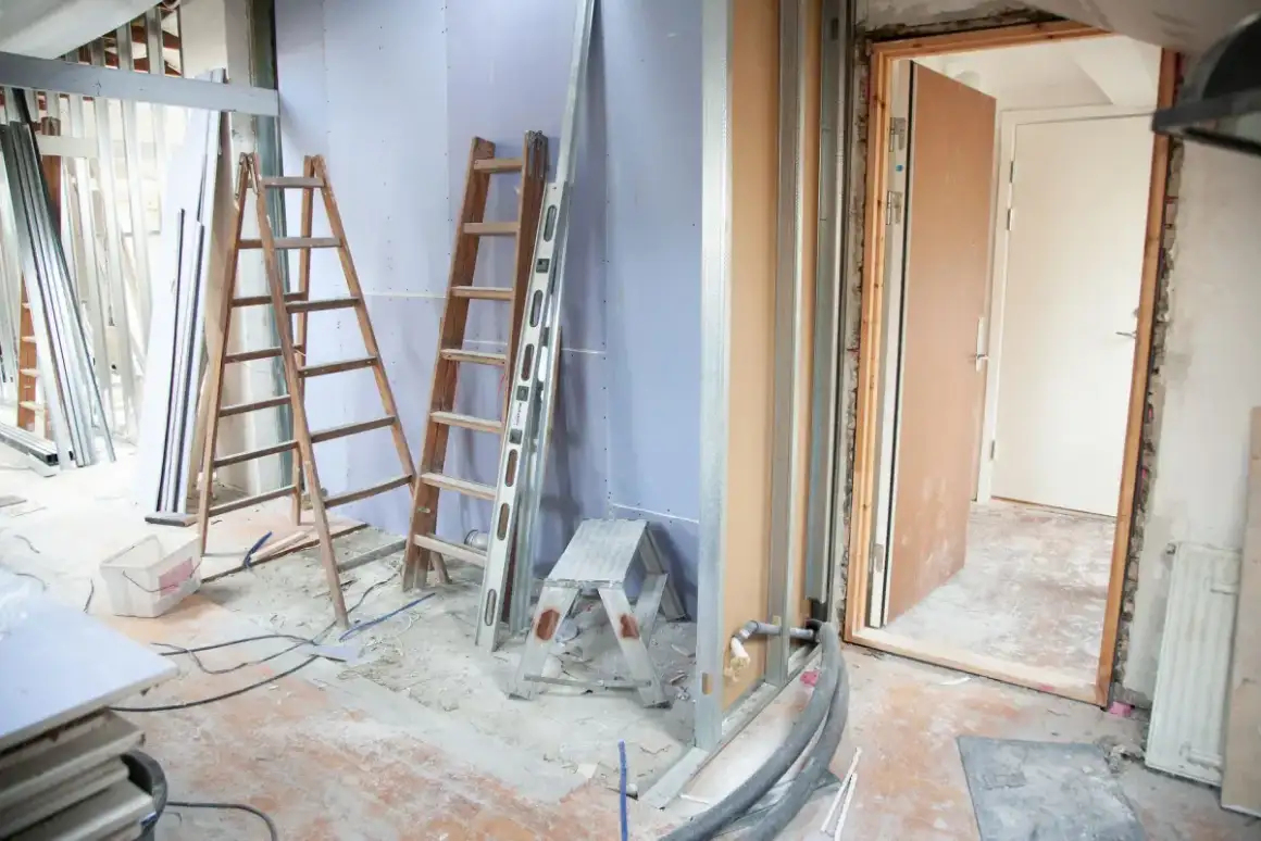 Room sheeted and contained with fixtures removed before ceiling texture is scraped