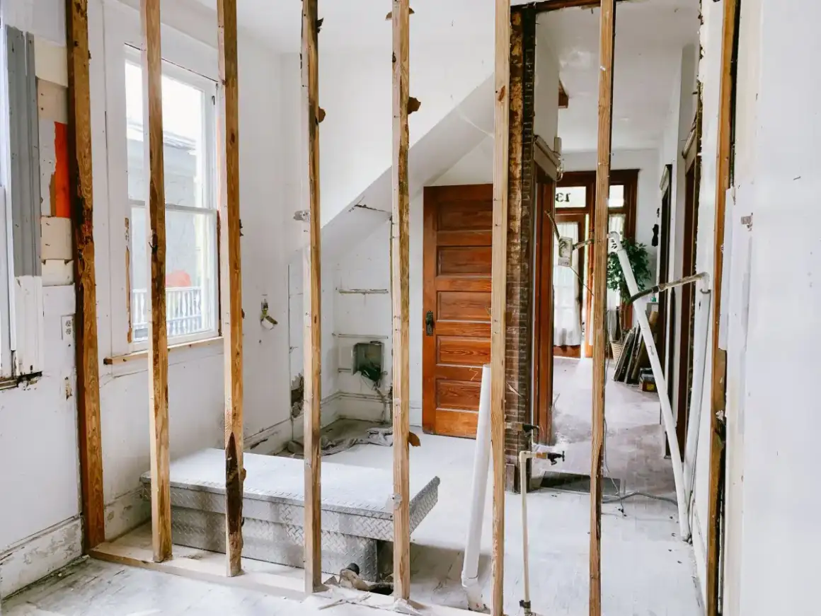 Open wall cavity with framing exposed to dry and be checked before reboarding
